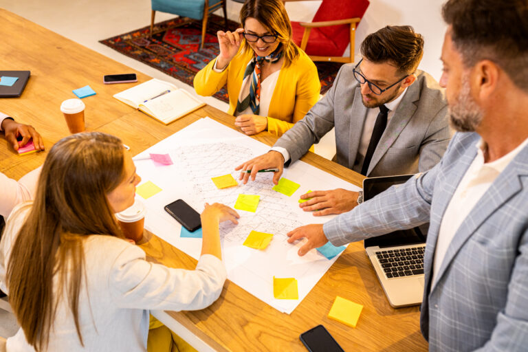 A sales team conducting a sales plan for their client.